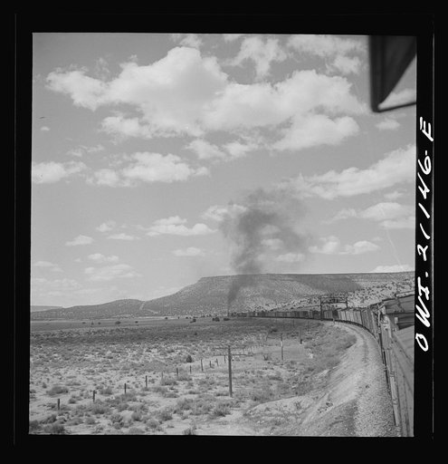 Laguna (vicinity), New Mexico. A train going around a curve along the Atchison, Topeka and Santa Fe Railroad between Belen and Gallup, New Mexico