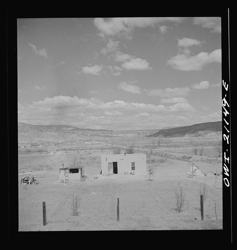 Laguna, New Mexico. An adobe house on the outskirts along the Atchison, Topeka and Santa Fe Railroad between Belen and Gallup, New Mexico