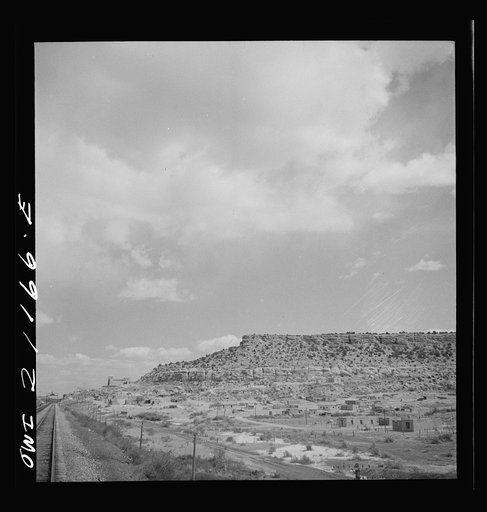 McCartys (vicinity), New Mexico. Passing by an Indian reservation along the Atchison, Topeka and Santa Fe Railroad between Belen and Gallup, New Mexico