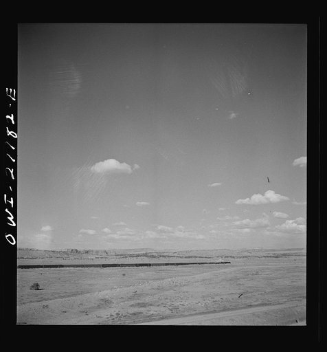 Untitled photo, possibly related to: South Chaves (vicinity), New Mexico. On the Atchison, Topeka and Santa Fe Railroad between Belen and Gallup, New Mexico, passing an eastbound passenger train