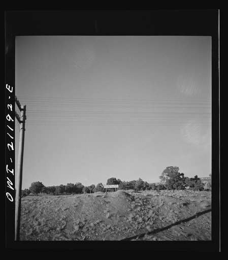 Passing a sign marking the Continental Divide along the Atchison, Topeka and Santa Fe Railroad between Belen and Gallup, New Mexico