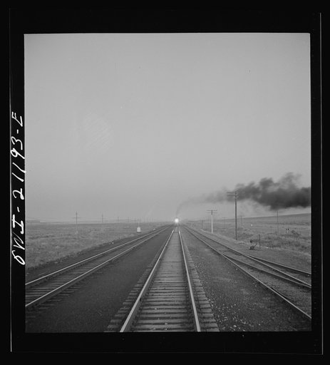 Untitled photo, possibly related to: Gallup, New Mexico. A train on the Atchison, Topeka and Santa Fe Railroad between Belen and Gallup, New Mexico