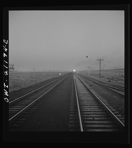 Untitled photo, possibly related to: Gallup, New Mexico. A train on the Atchison, Topeka and Santa Fe Railroad between Belen and Gallup, New Mexico