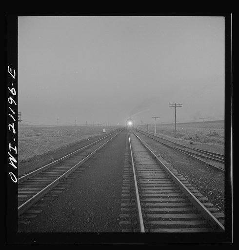 Untitled photo, possibly related to: Gallup, New Mexico. A train on the Atchison, Topeka and Santa Fe Railroad between Belen and Gallup, New Mexico