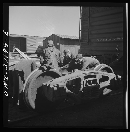 Untitled photo, possibly related to: Gallup, New Mexico. Laguna Indians working in the Atchison, Topeka and Santa Fe Railroad shops. There are about twenty of them employed in various capacities at the car shops