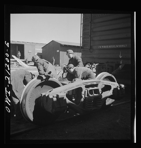 Gallup, New Mexico. Laguna Indians working in the Atchison, Topeka and Santa Fe Railroad shops. There are about twenty of them employed in various capacities at the car shops