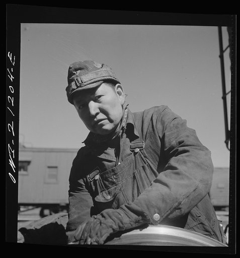 Gallup, New Mexico. Ben Acory, an Indian worker employed at the Atchison, Topeka and Santa Fe Railroad car shops