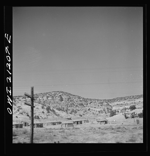 Manuelito, New Mexico. Indian "hogans" along the Atchison, Topeka and Santa Fe Railroad between Gallup, New Mexico and Winslow, Arizona