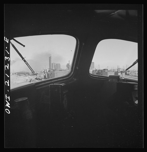Winslow, Arizona. Looking through the windshield of a diesel freight engine pulling out of the Atchison, Topeka and Santa Fe Railroad yard