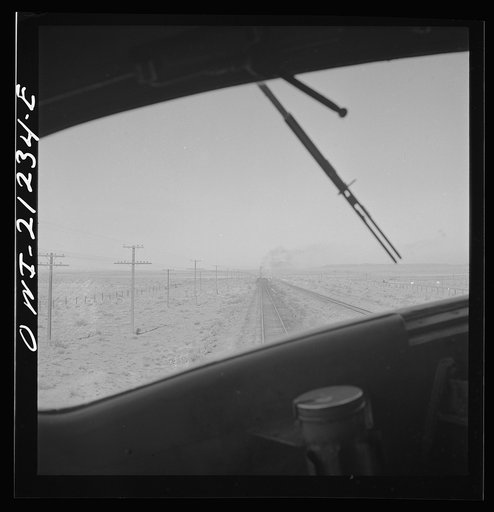 Untitled photo, possibly related to: The diesel freight train along the Atchison, Topeka and Santa Fe Railroad between Winslow and Seligman, Arizona stops for a red signal, since there is another train in the block ahead