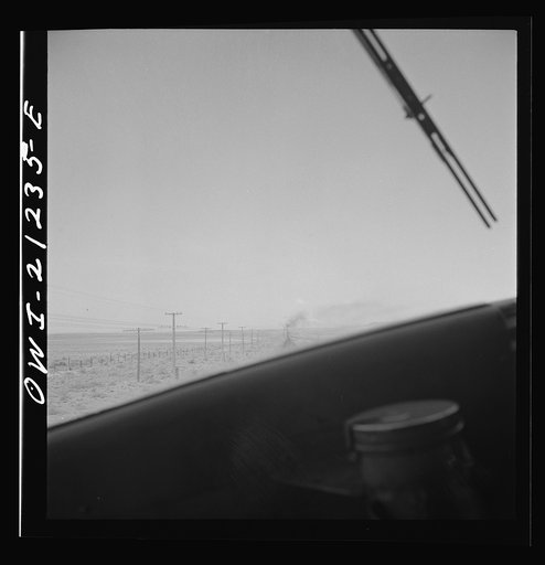 Untitled photo, possibly related to: The diesel freight train along the Atchison, Topeka and Santa Fe Railroad between Winslow and Seligman, Arizona stops for a red signal, since there is another train in the block ahead