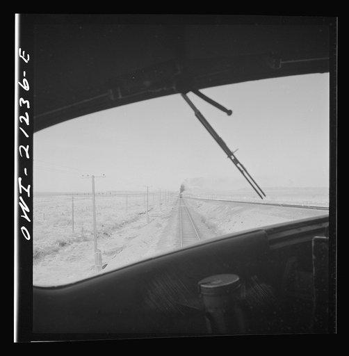 Untitled photo, possibly related to: The diesel freight train along the Atchison, Topeka and Santa Fe Railroad between Winslow and Seligman, Arizona stops for a red signal, since there is another train in the block ahead