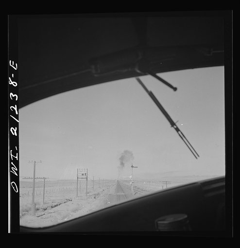 Untitled photo, possibly related to: The diesel freight train along the Atchison, Topeka and Santa Fe Railroad between Winslow and Seligman, Arizona stops for a red signal, since there is another train in the block ahead