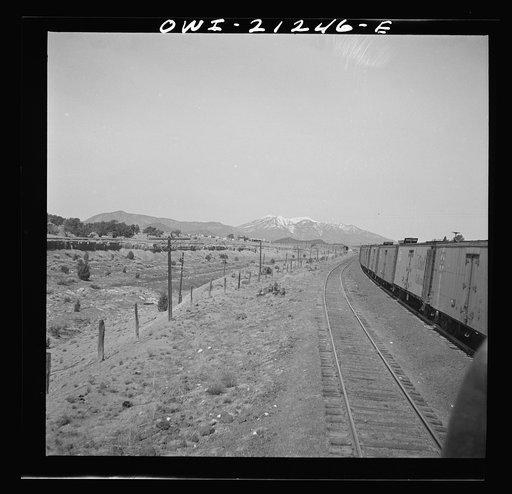 Untitled photo, possibly related to: Winona, Arizona. Passing another freight train in a siding along the Atchison, Topeka and Santa Fe Railroad between Winslow and Seligman, Arizona