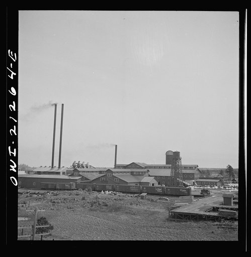 Flagstaff, Arizona. Passing a lumber mill along the Atchison, Topeka, and Santa Fe Railroad between Winslow and Seligman, Arizona