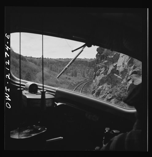 Williams, Arizona. On the Atchison, Topeka and Santa Fe Railroad between Winslow and Seligman, Arizona, going around a curve in the mountains