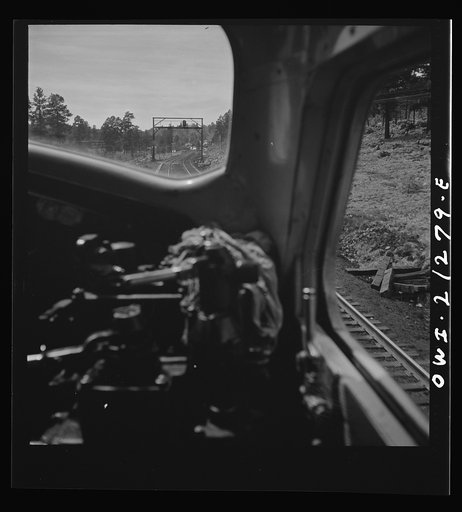 Williams (vicinity), Arizona. A diesel freight train on the Atchison, Topeka and Santa Fe Railroad between Winslow and Seligman, Arizona going through the mountains
