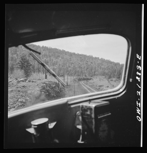 Untitled photo, possibly related to: Flagstaff, Arizona. Heading west into the mountains along the Atchison, Topeka, and Santa Fe Railroad between Winslow and Seligman, Arizona