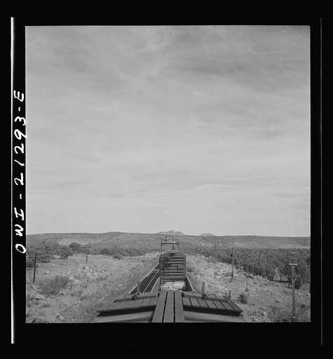 Untitled photo, possibly related to: Diesel freight train on the Atchison, Topeka and Santa Fe Railroad between Winslow and Seligman, Arizona going down the mountain from Supai to Ash Fork, Arizona, a drop of about 1600 feet