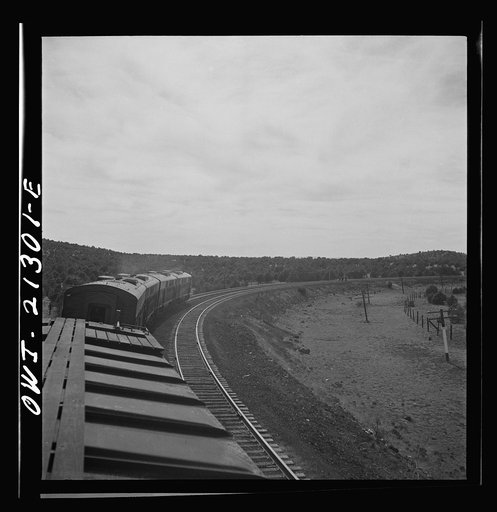 Untitled photo, possibly related to: Diesel freight train on the Atchison, Topeka and Santa Fe Railroad between Winslow and Seligman, Arizona going down the mountain from Supai to Ash Fork, Arizona, a drop of about 1600 feet