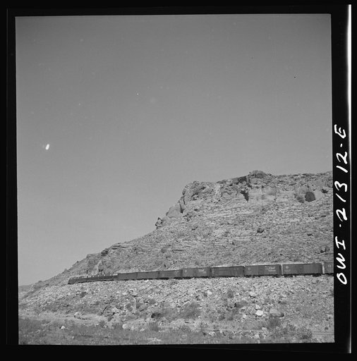 Kingman (vicinity), Arizona. An eastbound diesel freight train on the Atchison, Topeka and Santa Fe Railroad between Seligman, Arizona and Needles, California climbing the mountains