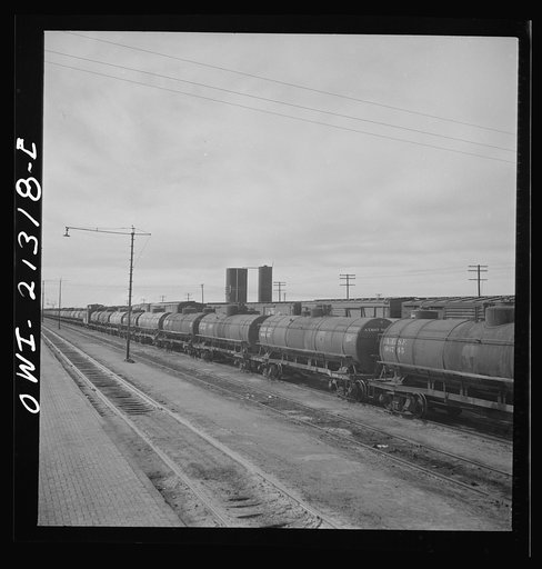 Untitled photo, possibly related to: Ash Fork, Arizona. Tank cars in the Atchison, Topeka and Santa Fe Railroad yard