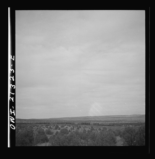 Untitled photo, possibly related to: Gleed (vicinity), Arizona. A freight train going around a curve on the Atchison, Topeka and Santa Fe Railroad between Winslow and Seligman, Arizona