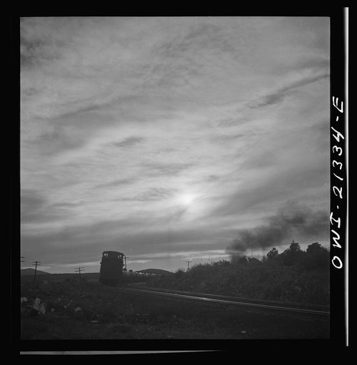 Gleed (vicinity), Arizona. A westbound local freight train passing on the Atchison, Topeka and Santa Fe Railroad between Winslow and Seligman, Arizona