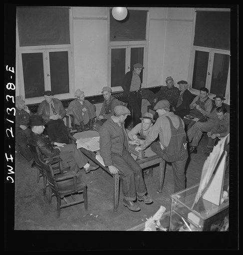 Untitled photo, possibly related to: Seligman, Arizona. Railroad men lounging in the lobby of the Harvey House near the Atchison, Topeka, and Santa Fe Railroad yard