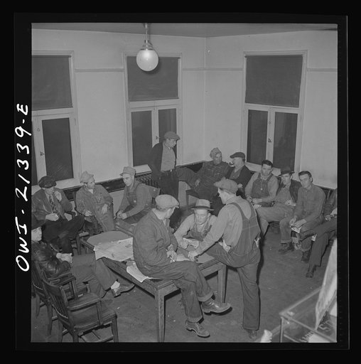 Seligman, Arizona. Railroad men lounging in the lobby of the Harvey House near the Atchison, Topeka, and Santa Fe Railroad yard