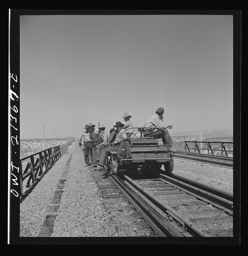 Untitled photo, possibly related to: Yucca, Arizona. A section crew returning from work on the Atchison, Topeka and Santa Fe Railroad between Seligman, Arizona and Needles, California