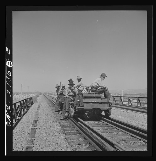 Yucca, Arizona. A section crew returning from work on the Atchison, Topeka and Santa Fe Railroad between Seligman, Arizona and Needles, California