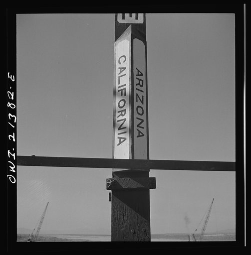 Topock (vicinity), Arizona. A state line marker on a bridge over the Colorado River on the Atchison, Topeka and Santa Fe Railroad between Seligman, Arizona and Needles, California