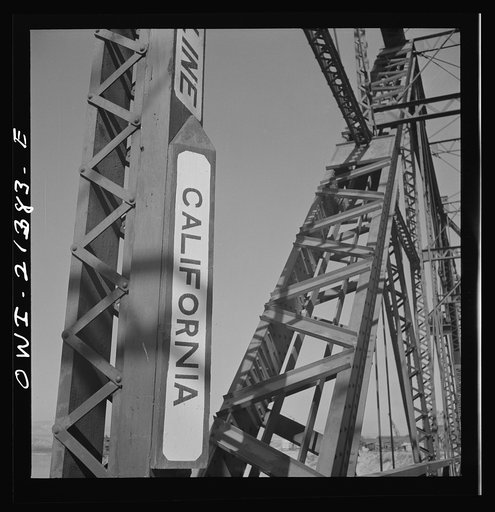 Topock (vicinity), Arizona. A state line marker on a bridge over the Colorado River on the Atchison, Topeka and Santa Fe Railroad between Seligman, Arizona and Needles, California