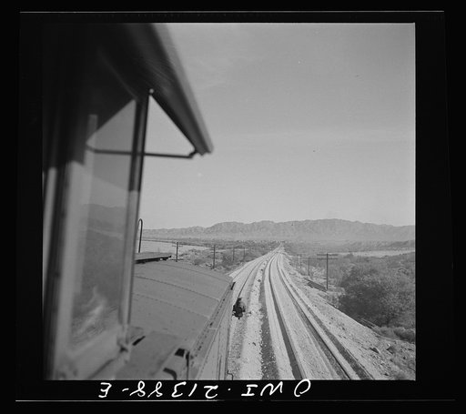 Needles (vicinity), California. Coming across a newly-laid road bed on the Atchison, Topeka and Santa Fe Railroad between Seligman, Arizona and Needles, California