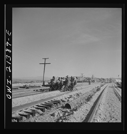 Needles, California. An Indian section gang at work on the tracks in the Atchison, Topeka and Santa Fe Railroad yards