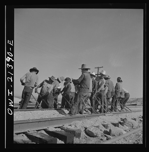 Untitled photo, possibly related to: Needles, California. An Indian section gang at work on the tracks in the Atchison, Topeka and Santa Fe Railroad yards