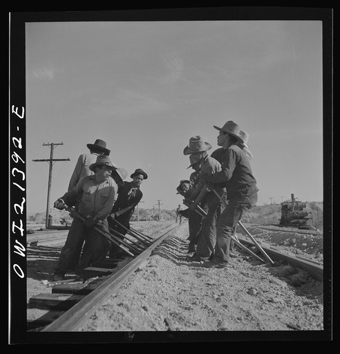 Needles, California. An Indian section gang at work on the tracks in the Atchison, Topeka and Santa Fe Railroad yards