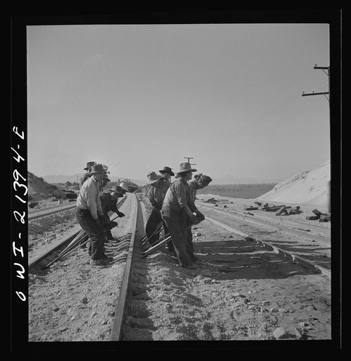 Untitled photo, possibly related to: Needles, California. An Indian section gang at work on the tracks in the Atchison, Topeka and Santa Fe Railroad yards