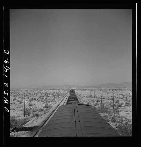 The Atchison, Topeka, and Santa Fe Railroad train between Needles and Barstow, California cuts west across the Mojave Desert
