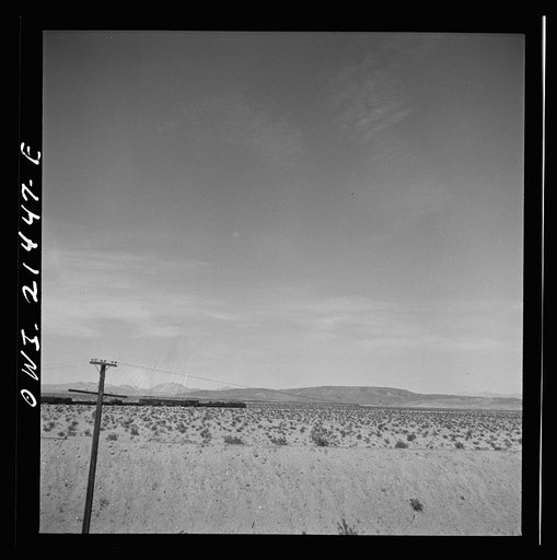 Untitled photo, possibly related to: Klondike (vicinity), California. Going around a curve on the Atchison, Topeka and Santa Fe Railroad between Needles and Barstow, California