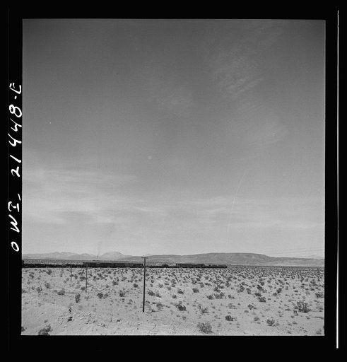 Untitled photo, possibly related to: Klondike (vicinity), California. Going around a curve on the Atchison, Topeka and Santa Fe Railroad between Needles and Barstow, California