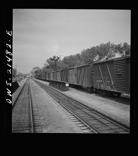 Victorville, California. Going through a town on the Atchison, Topeka and Santa Fe Railroad between Barstow and San Bernardino, California