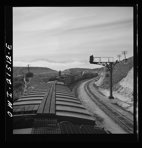 Summit (vicinity), California. Going down the mountains on the Atchison, Topeka, and Santa Fe Railroad between Barstow and San Bernardino, California