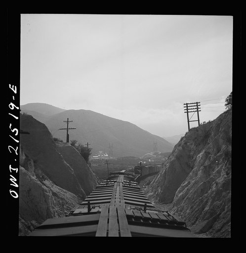 Summit (vicinity), California. Going down the mountains on the Atchison, Topeka, and Santa Fe Railroad between Barstow and San Bernardino, California