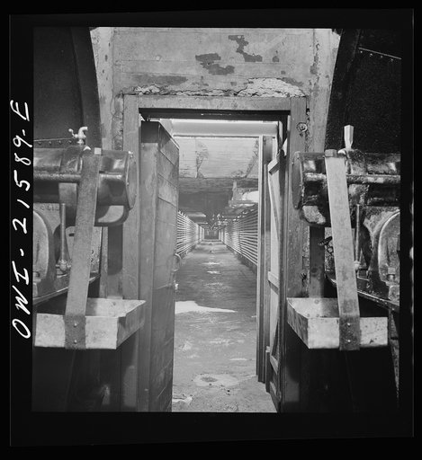 San Bernardino, California. A tunnel at the ice plant through which air is blown on its way to the refrigerator cars. Cooling tubes along the walls keep the air at a constant temperature