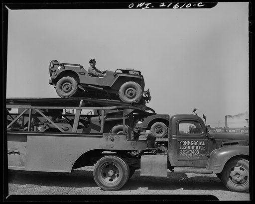 Detroit, Michigan. Loading a haulaway truck with army cars