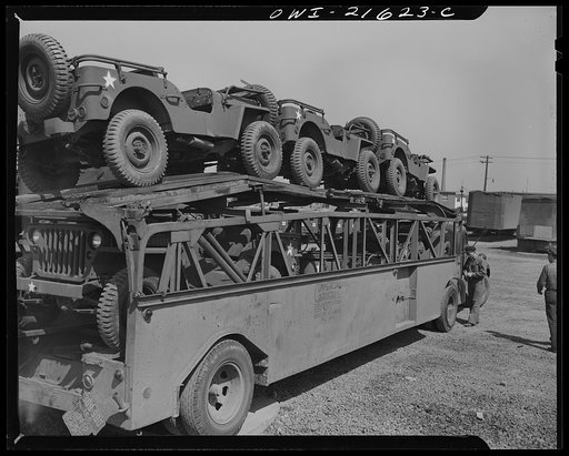 Detroit, Michigan. A haulaway loaded with army cars