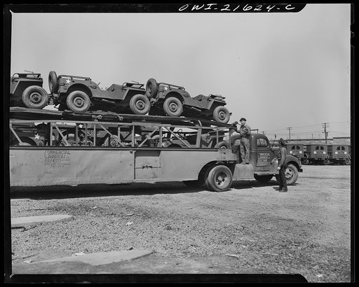 Detroit, Michigan. A haulaway loaded with army cars