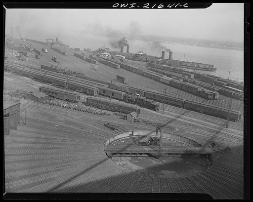 Detroit, Michigan (?). A railroad freight yard showing a railroad car turntable in the foreground
